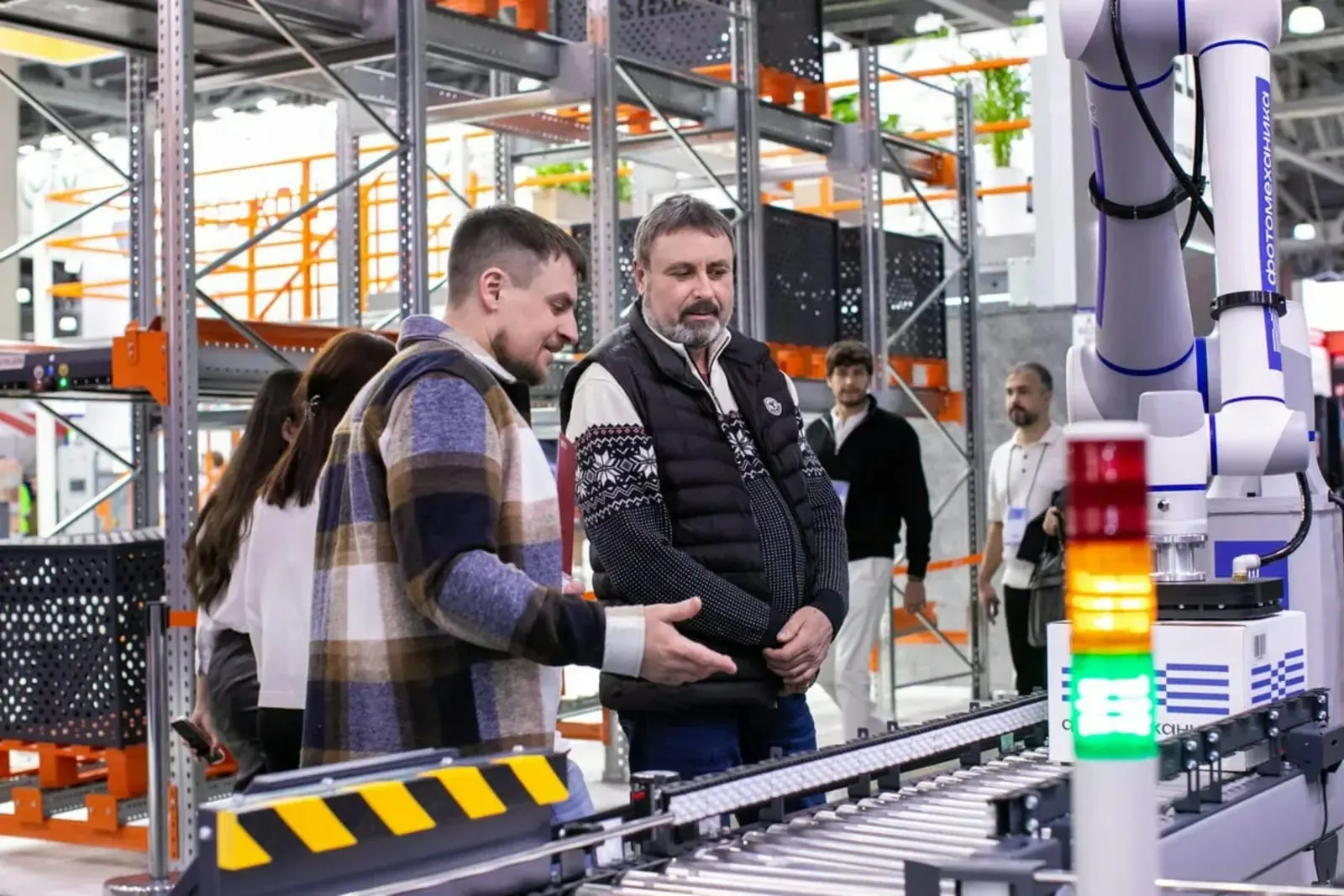 Operations professionals reviewing an automated production system